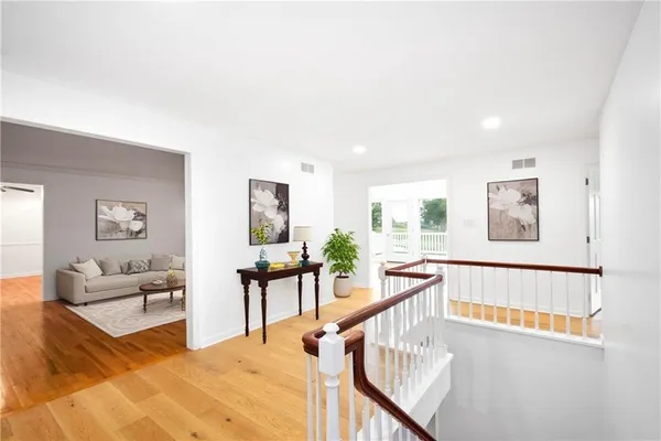 a view of a living room filled with furniture and window