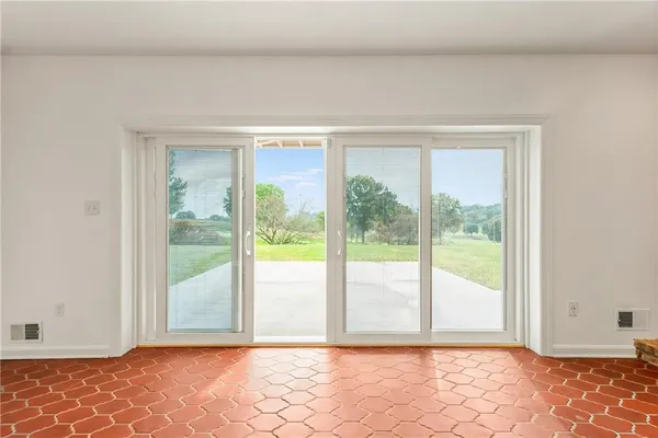 an empty room with an empty space and wooden floor