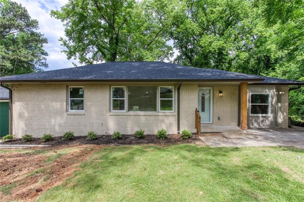 2131 Glendale Drive Decatur, GA 30032 - Photo 2 of 26 a house with trees in the background