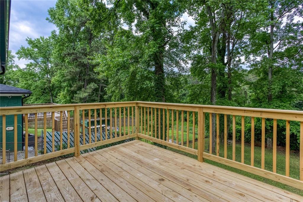 2131 Glendale Drive Decatur, GA 30032 - Photo 21 of 26 a view of balcony with wooden floor and fence