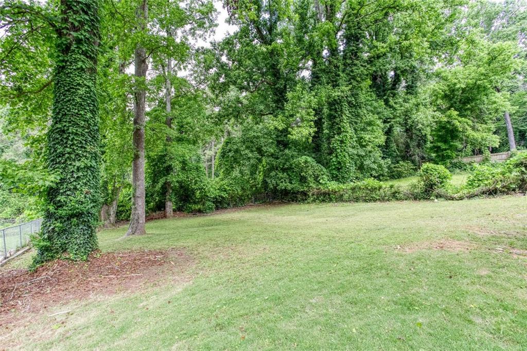 2131 Glendale Drive Decatur, GA 30032 - Photo 23 of 26 a view of a field with trees in the background