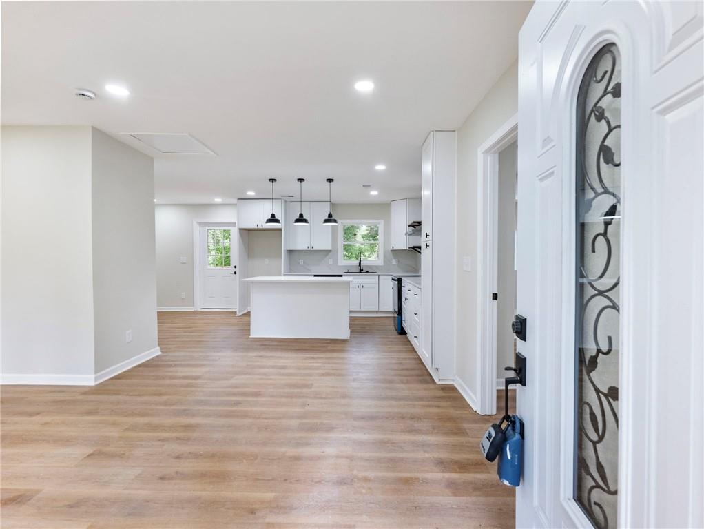 2131 Glendale Drive Decatur, GA 30032 - Photo 3 of 26 a view of a kitchen with a sink wooden floor and a living room