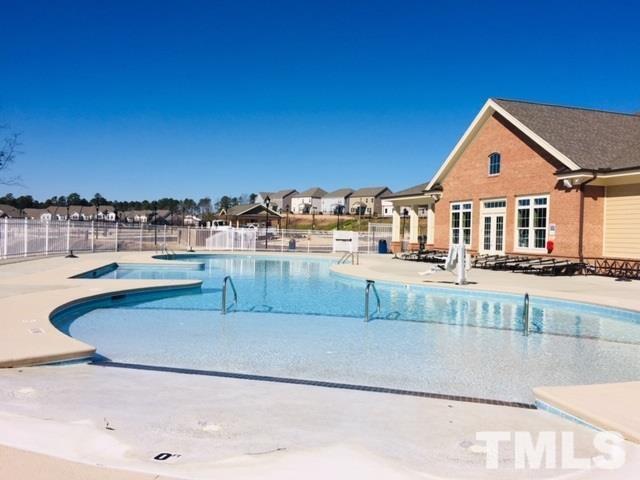 1027 Islip Place Durham, NC 27703 - Photo 11 of 18 a view of a house with a swimming pool