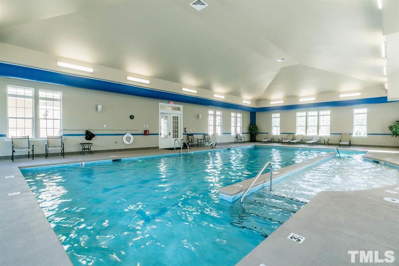 1027 Islip Place Durham, NC 27703 - Photo 12 of 18 a view of a living room and kitchen floor to ceiling windows