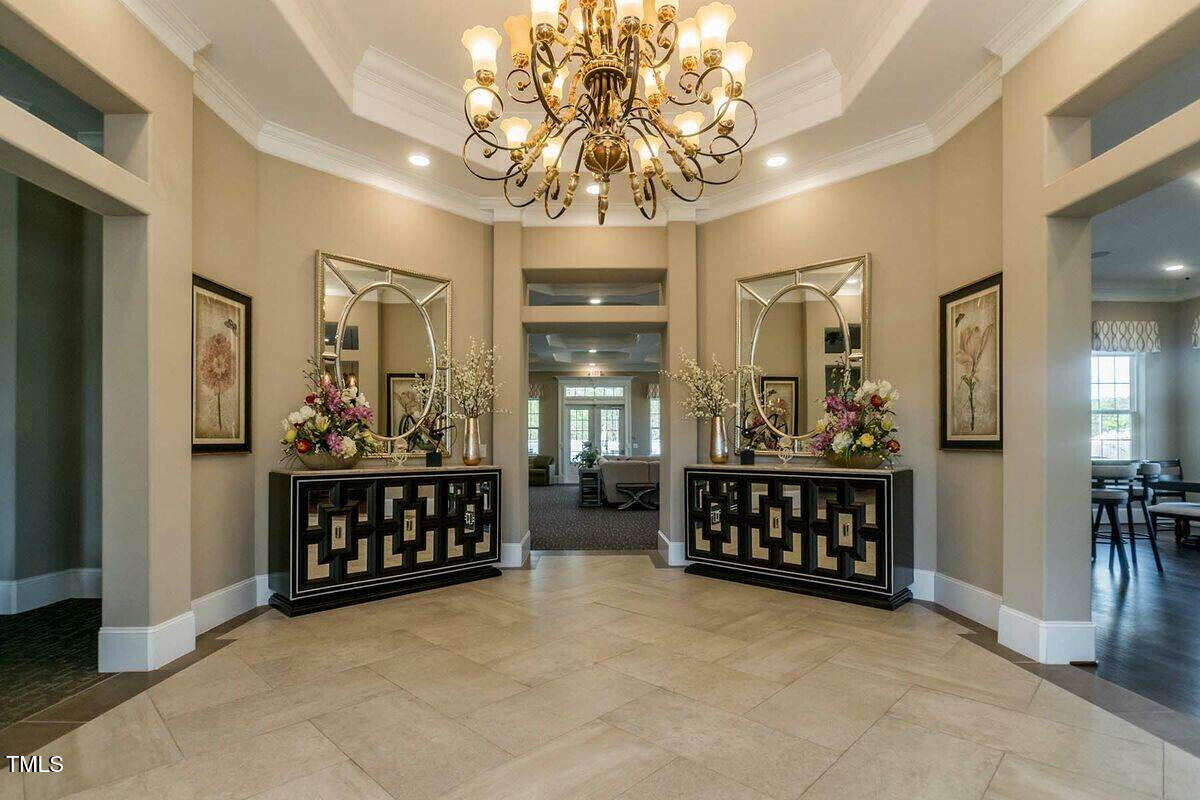 1027 Islip Place Durham, NC 27703 - Photo 8 of 18 a view of a room with furniture and chandelier