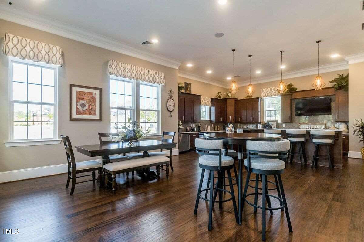 1027 Islip Place Durham, NC 27703 - Photo 9 of 18 a dining room with furniture window and wooden floor