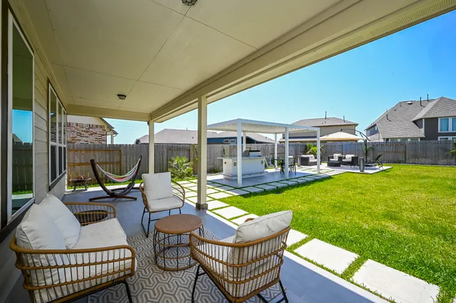 a view of a patio with couches chairs and a table and chairs