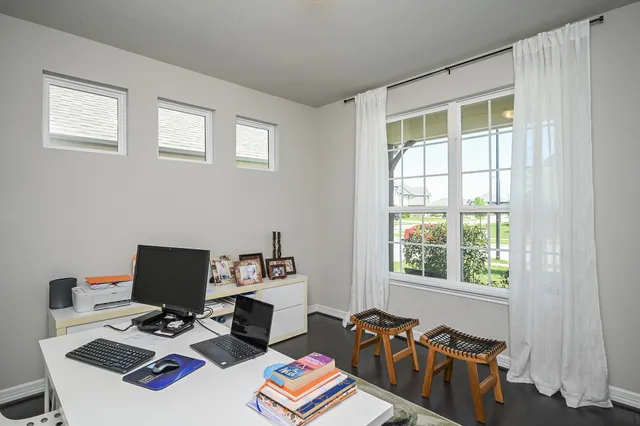 a workspace with furniture and window