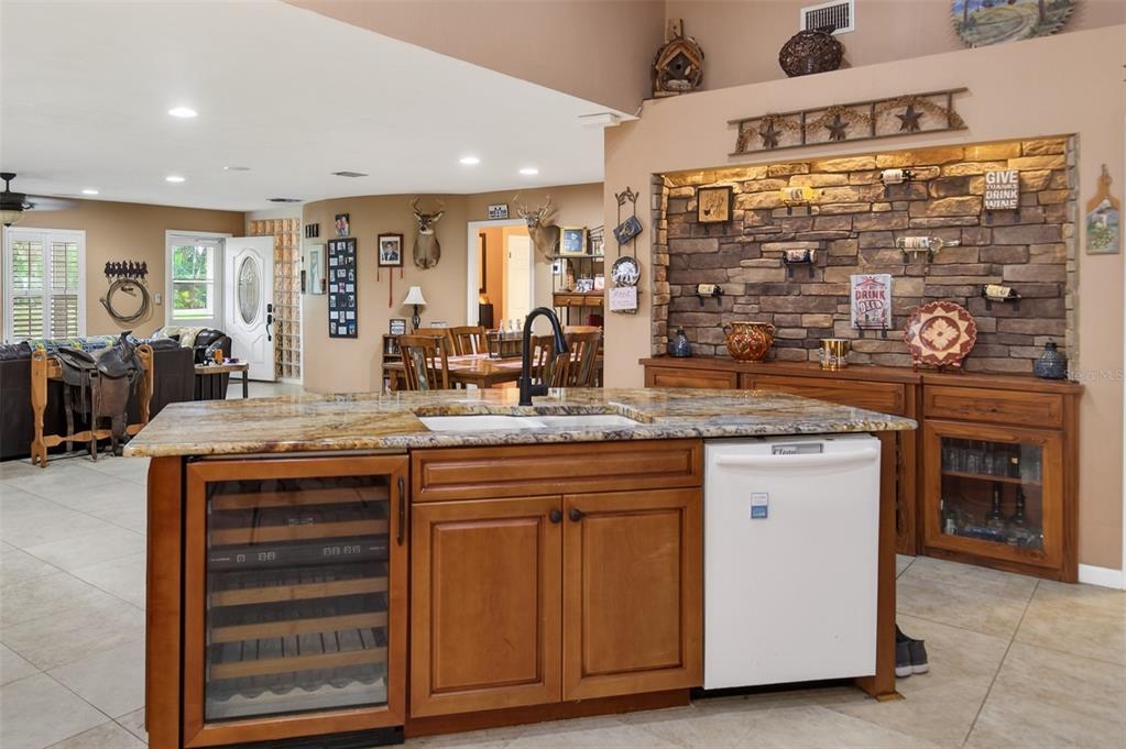 2218 River Ridge Road DeLand, FL 32720 - Photo 12 of 52 a kitchen with granite countertop a sink and cabinets