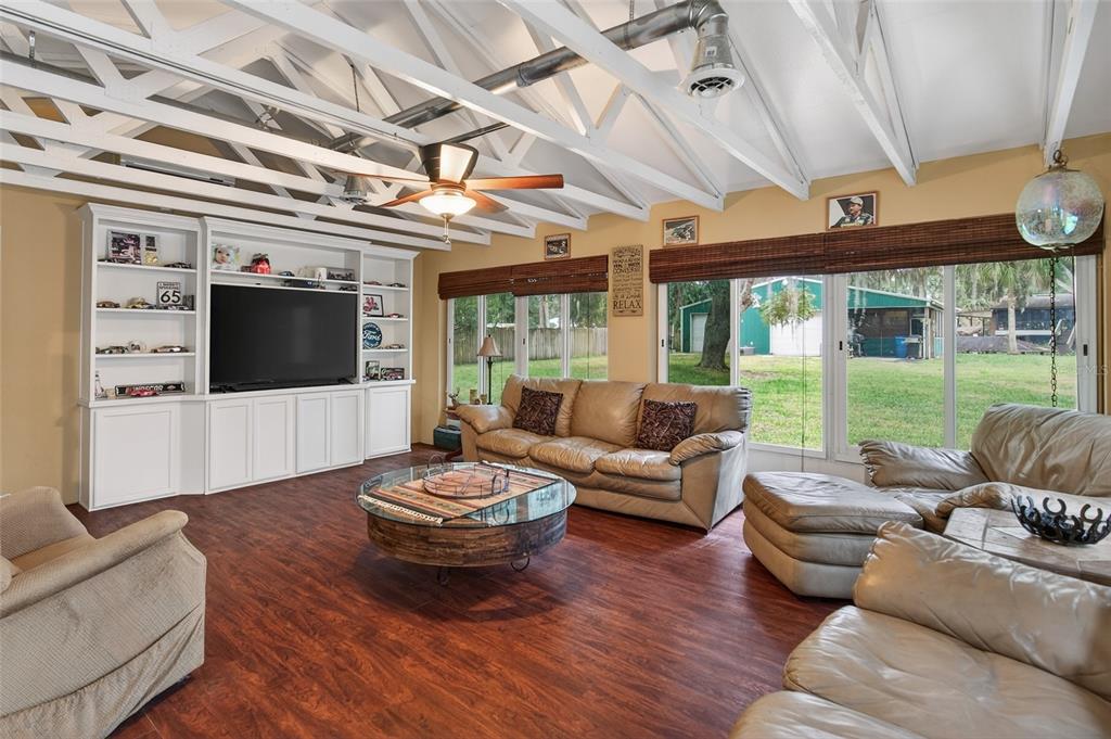 2218 River Ridge Road DeLand, FL 32720 - Photo 13 of 52 a living room with furniture and a flat screen tv