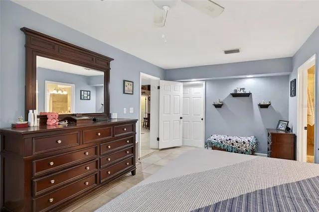 a bedroom with a bed and a dresser