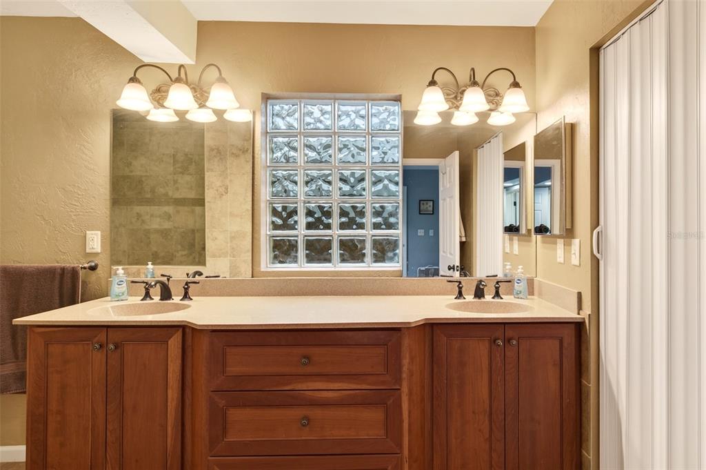 2218 River Ridge Road DeLand, FL 32720 - Photo 19 of 52 a bathroom with a sink and a large mirror