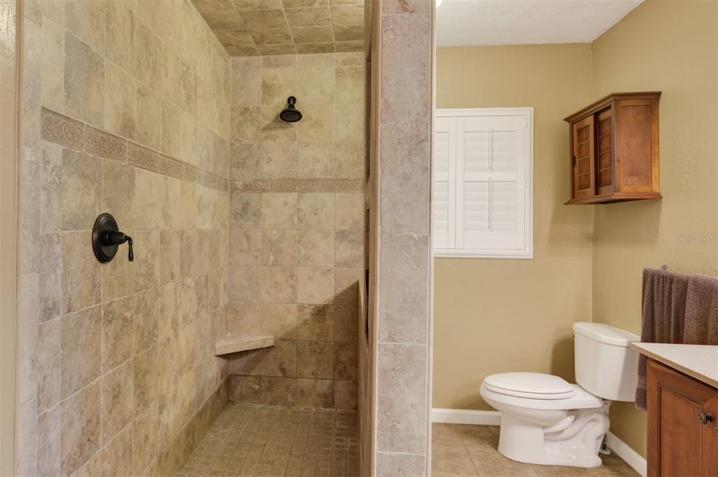 2218 River Ridge Road DeLand, FL 32720 - Photo 20 of 52 a bathroom with a toilet and a shower