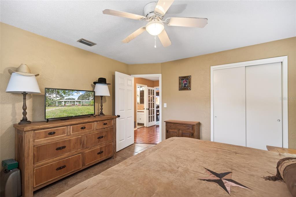 2218 River Ridge Road DeLand, FL 32720 - Photo 26 of 52 a living room with furniture and a flat screen tv