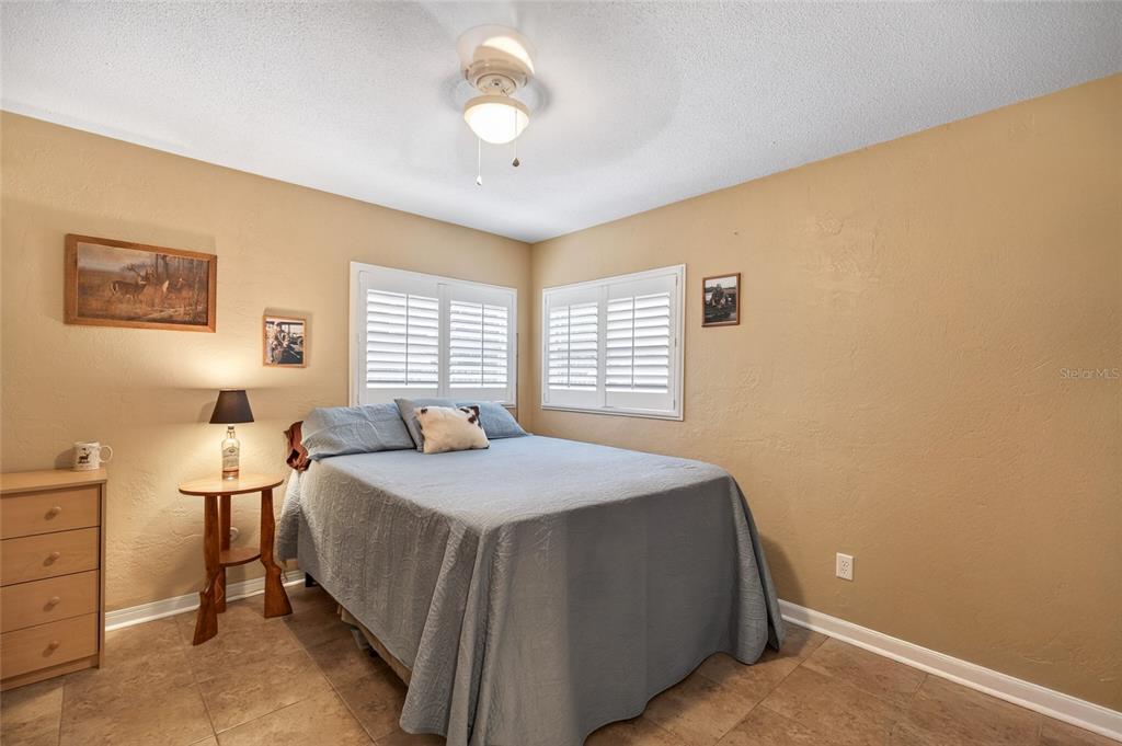 2218 River Ridge Road DeLand, FL 32720 - Photo 27 of 52 a bedroom with a bed and a window