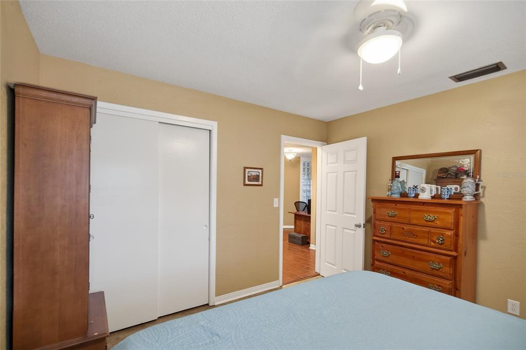 2218 River Ridge Road DeLand, FL 32720 - Photo 28 of 52 a room with furniture and a chandelier