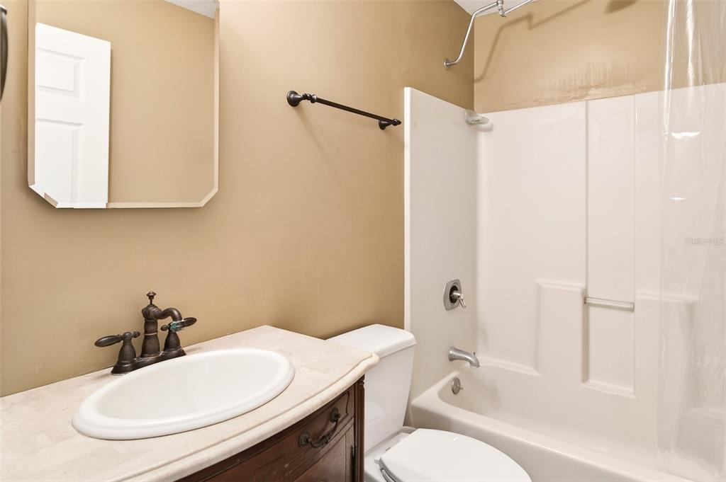 2218 River Ridge Road DeLand, FL 32720 - Photo 29 of 52 a bathroom with a sink toilet and shower