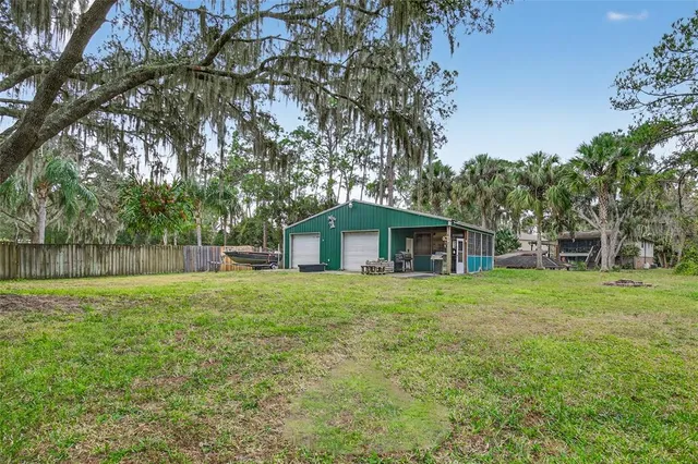 a yellow house in middle of the forest