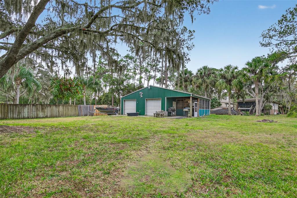 2218 River Ridge Road DeLand, FL 32720 - Photo 31 of 52 a yellow house in middle of the forest