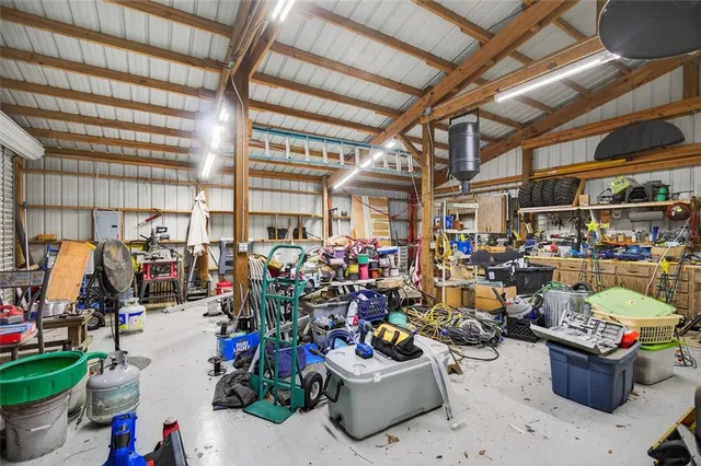 a view of a yard with a house in the background