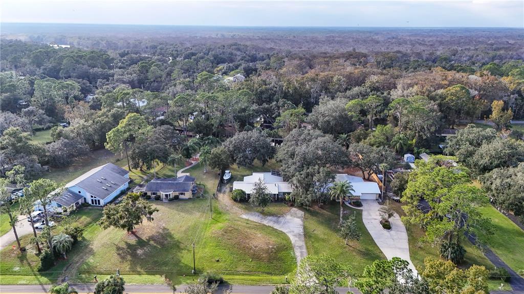 2218 River Ridge Road DeLand, FL 32720 - Photo 36 of 52 an aerial view of a house with a yard