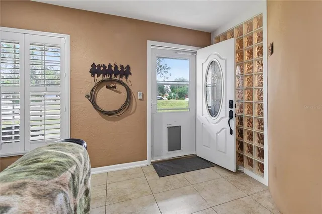 a view of a door and utility room with windows