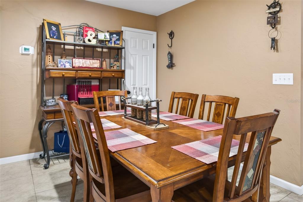 2218 River Ridge Road DeLand, FL 32720 - Photo 7 of 52 a view of a dining room with furniture