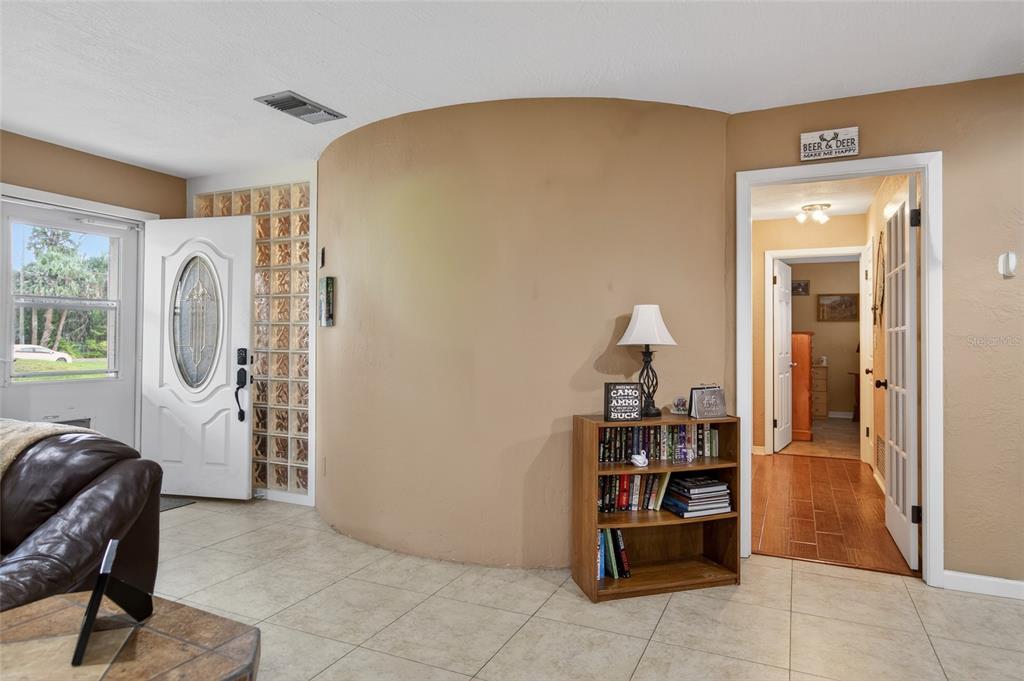 2218 River Ridge Road DeLand, FL 32720 - Photo 8 of 52 a living room with furniture and wooden floor