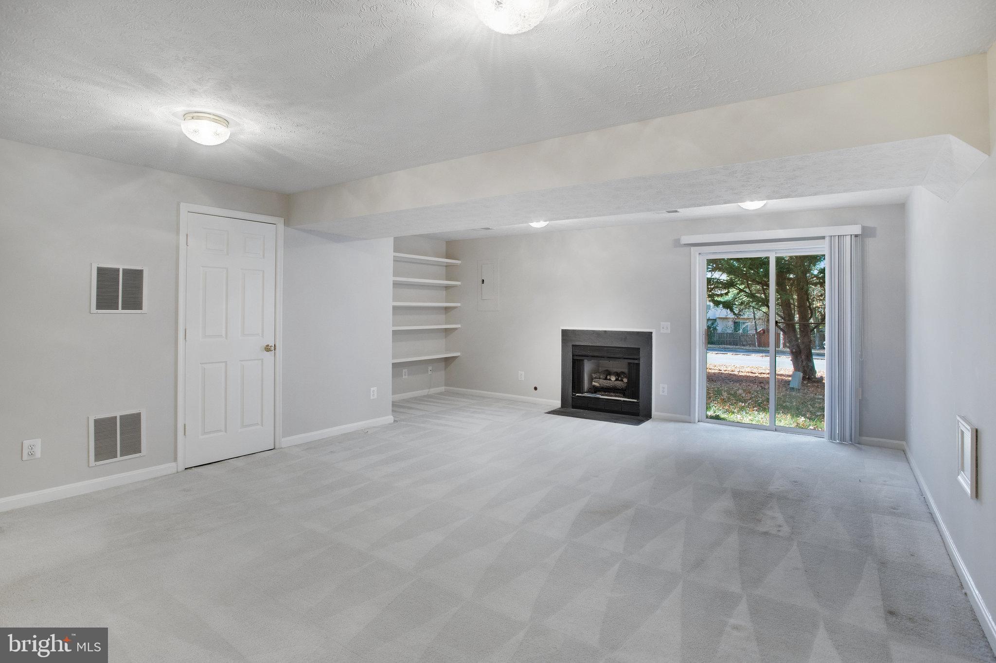 3055 Cahill Lane Dumfries, VA 22026 - Photo 28 of 33 Built in Shelving and Walk out to the backyard