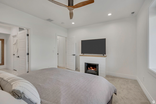 1720 Hillcrest Circle Mapleton, UT 84664 - Photo 76 of 116 Bedroom with light carpet, recessed lighting, a warm lit fireplace, and ceiling fan