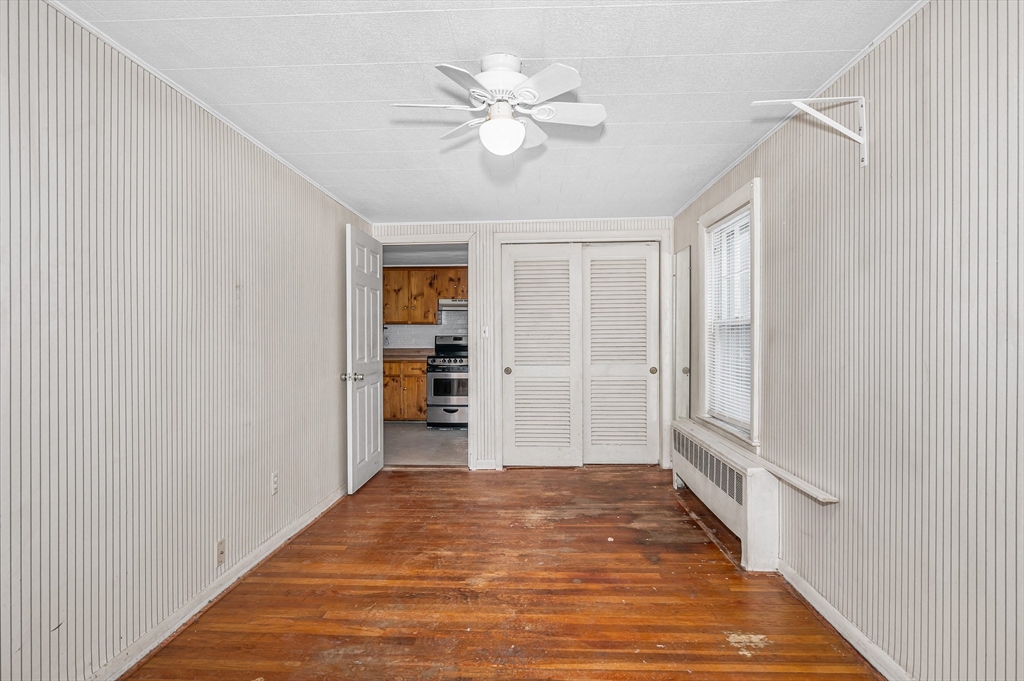 126 Groton Road Chelmsford, MA 01863 - Photo 13 of 38 wooden floor in an empty room with a window