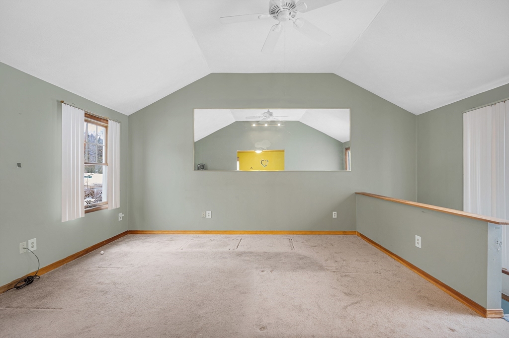 126 Groton Road Chelmsford, MA 01863 - Photo 16 of 38 an empty room with a window and chandelier fan