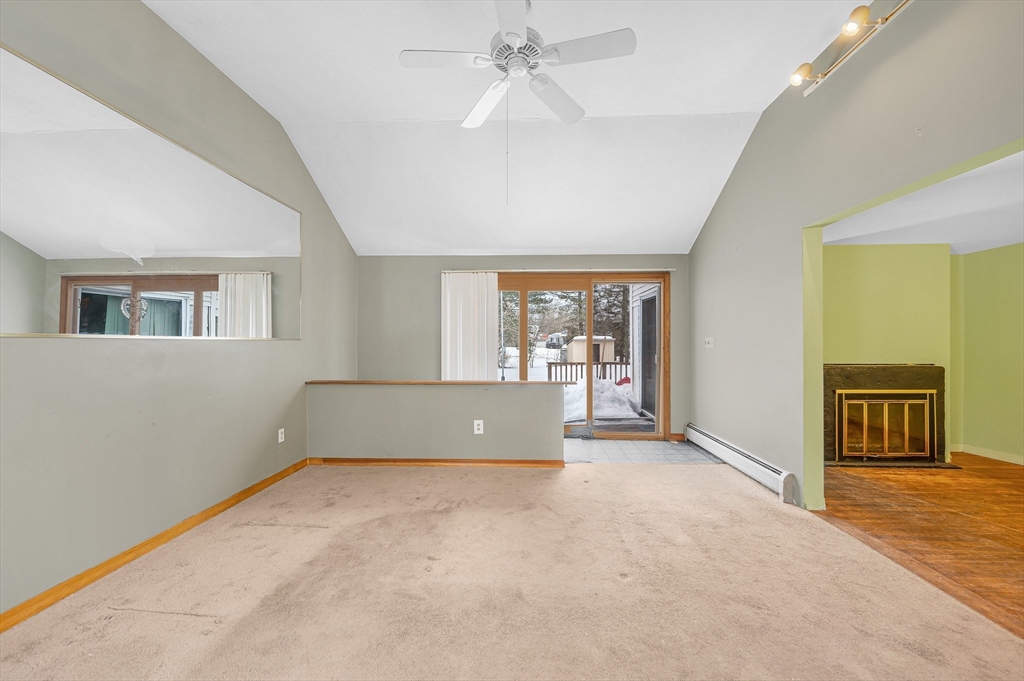 126 Groton Road Chelmsford, MA 01863 - Photo 17 of 38 an empty room with chandelier fan and windows