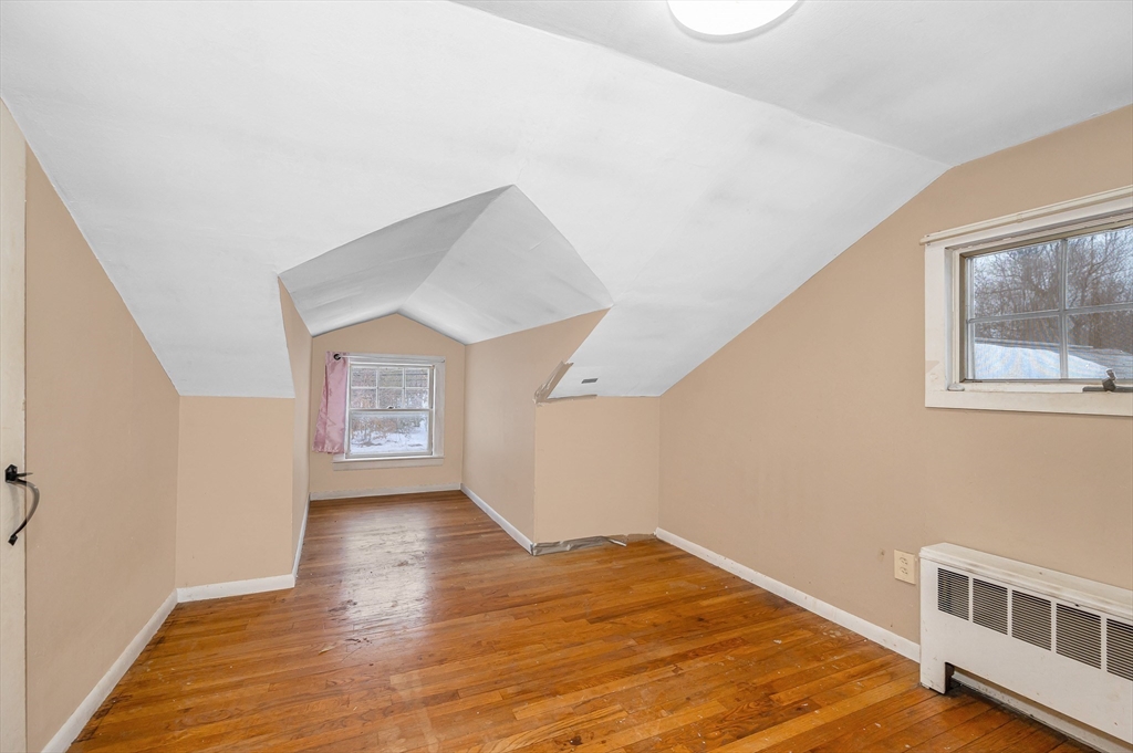 126 Groton Road Chelmsford, MA 01863 - Photo 20 of 38 a view of an empty room with wooden floor and a window