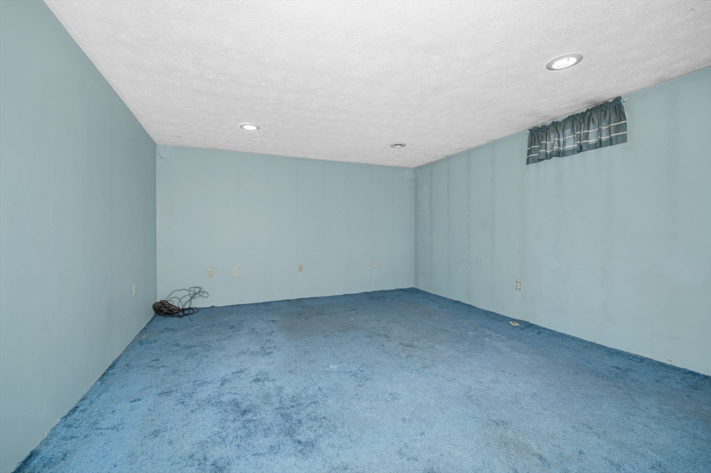 126 Groton Road Chelmsford, MA 01863 - Photo 26 of 38 an empty room with a workbench