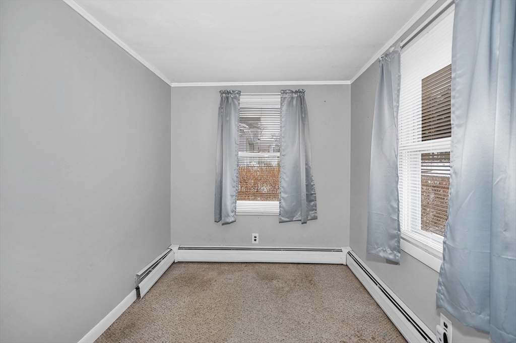 126 Groton Road Chelmsford, MA 01863 - Photo 4 of 38 a view of an empty room with a window