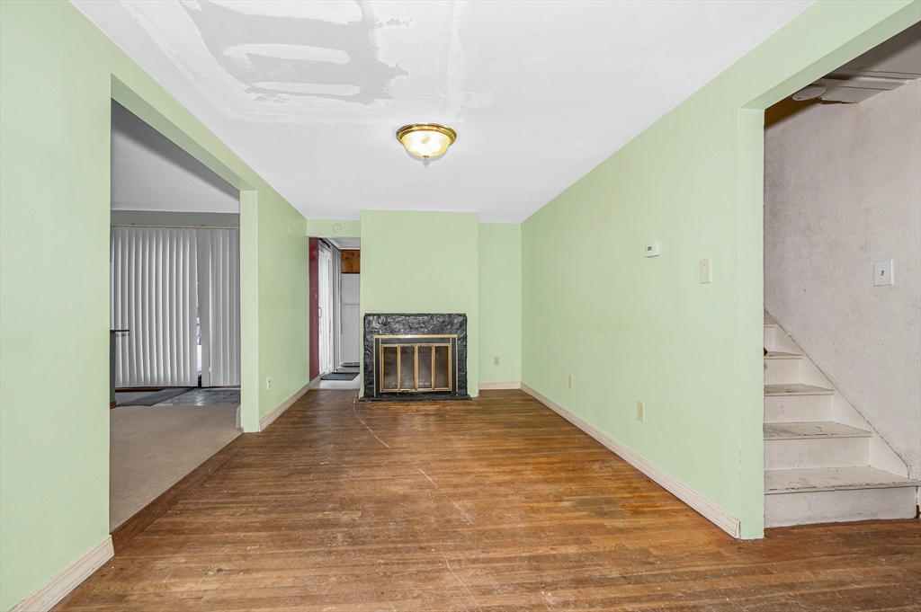 126 Groton Road Chelmsford, MA 01863 - Photo 5 of 38 a view of an empty room with wooden floor