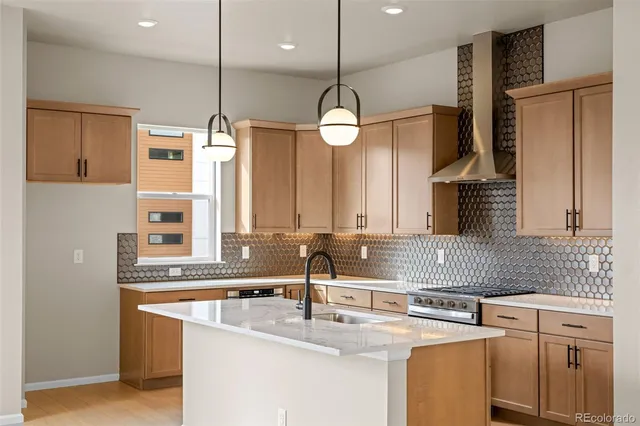 a kitchen with a sink and a stove top oven