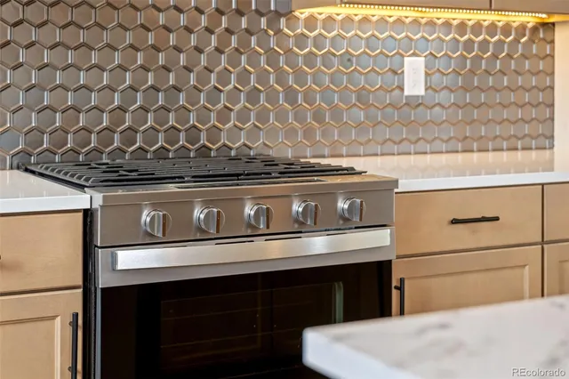 a kitchen with sink cabinets and wooden floor