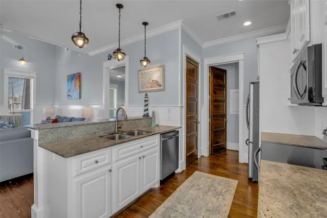 a kitchen with a sink stove and microwave