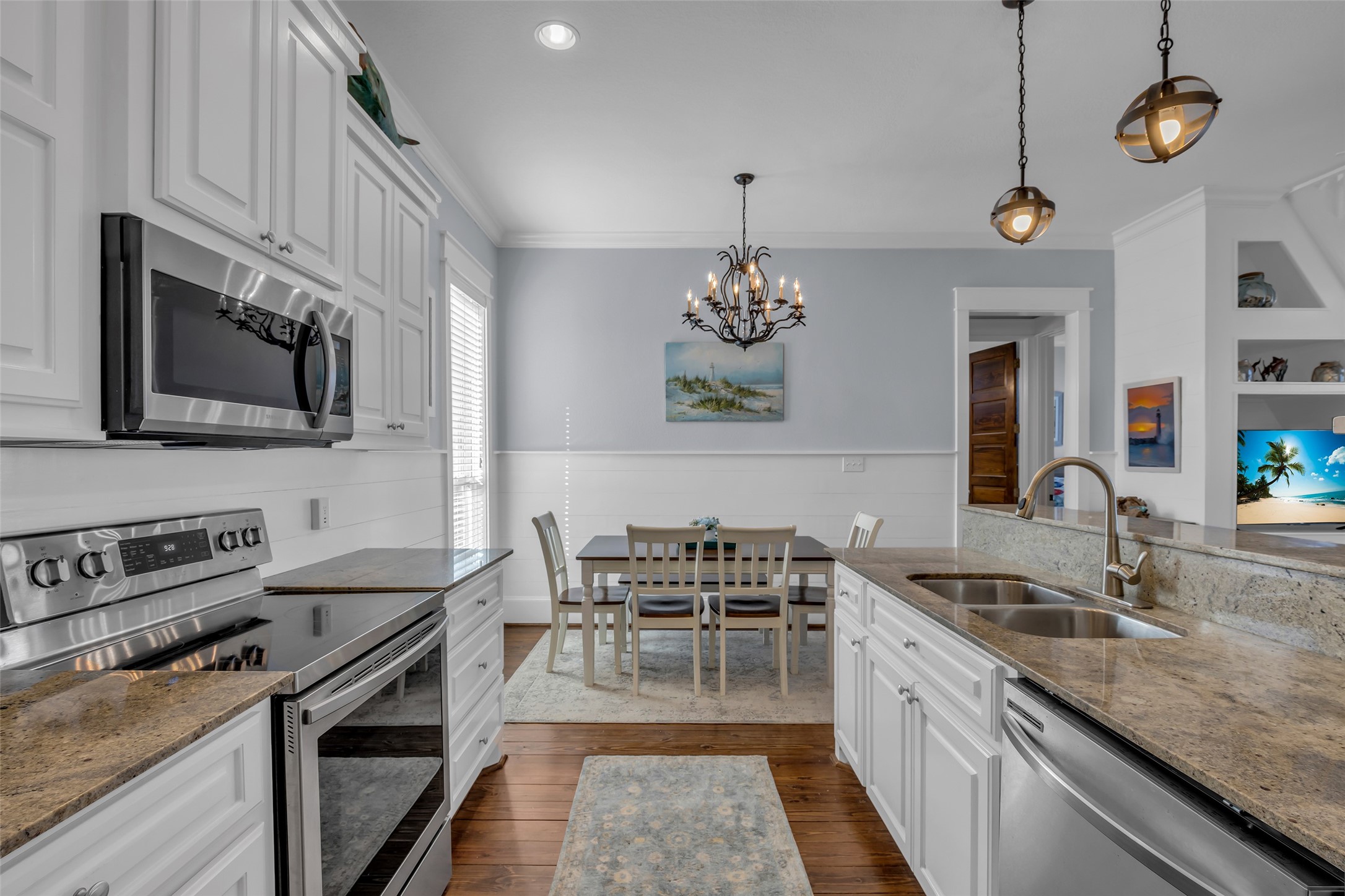 911 Tidelands Crystal Beach, TX 77650 - Photo 17 of 25 a kitchen with a sink stove and microwave
