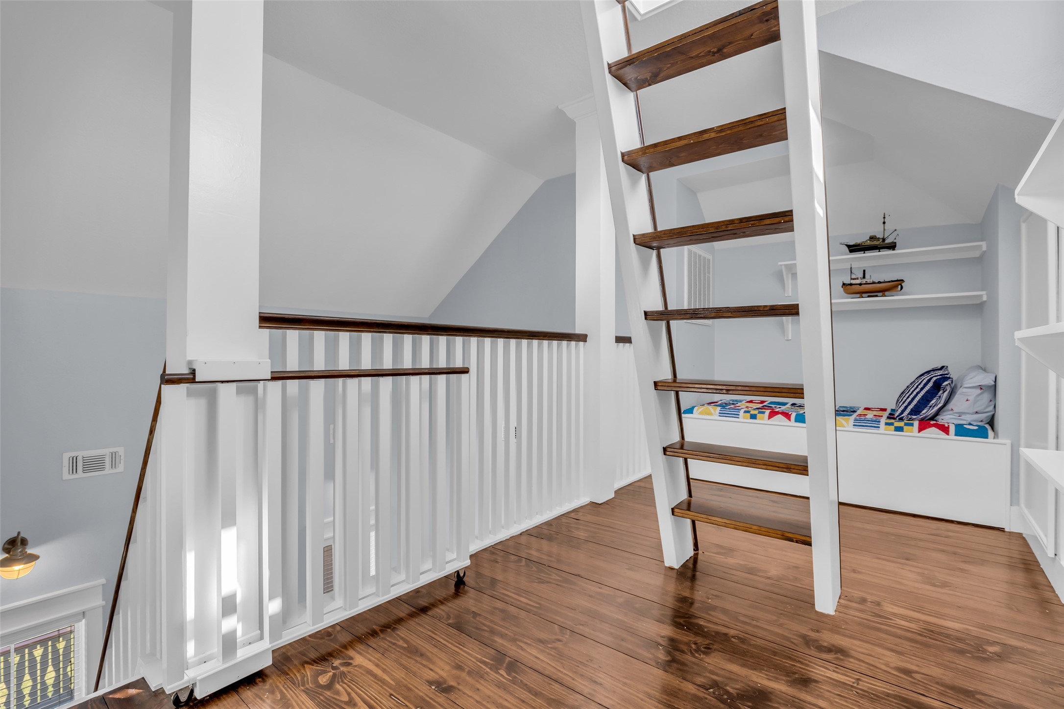911 Tidelands Crystal Beach, TX 77650 - Photo 24 of 25 a view of a hallway with wooden floor and entryway