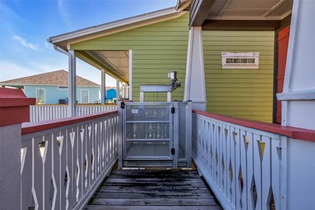 a view of a house with wooden fence