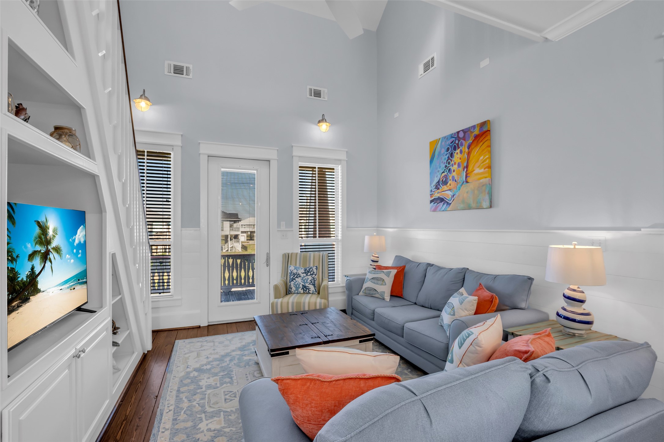 911 Tidelands Crystal Beach, TX 77650 - Photo 9 of 25 a living room with furniture and a flat screen tv