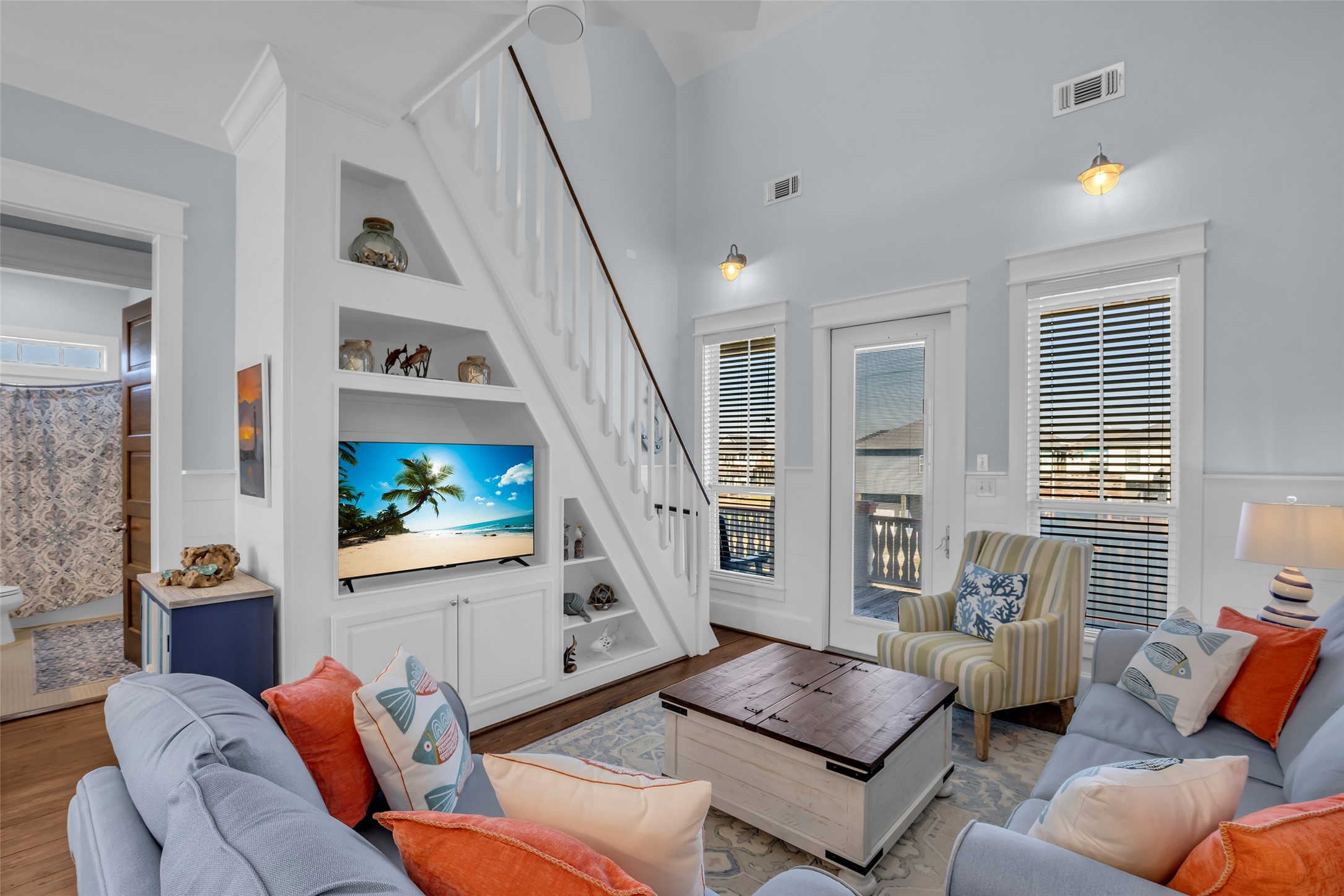 911 Tidelands Crystal Beach, TX 77650 - Photo 10 of 25 a living room with furniture and a flat screen tv