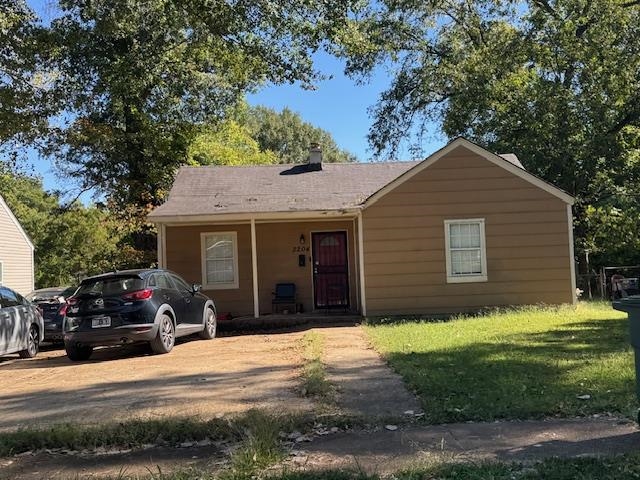 3204 Millwood Road Memphis, TN 38109 - Photo 2 of 3 a front view of a house with a yard and garage