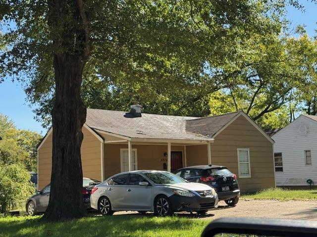 3204 Millwood Road Memphis, TN 38109 - Photo 3 of 3 a car parked in front of white house
