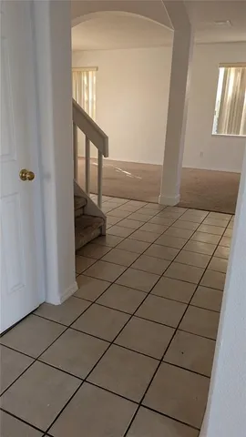 a view of a brick house with a white door