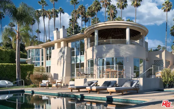a front view of a house with swimming pool