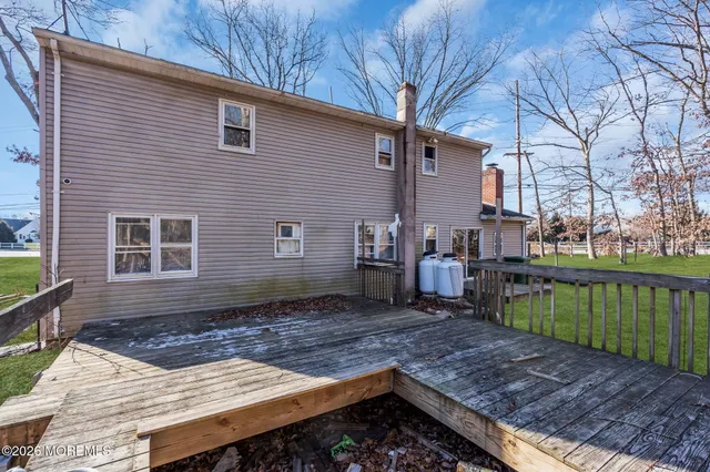 a view of a bench next to a yard